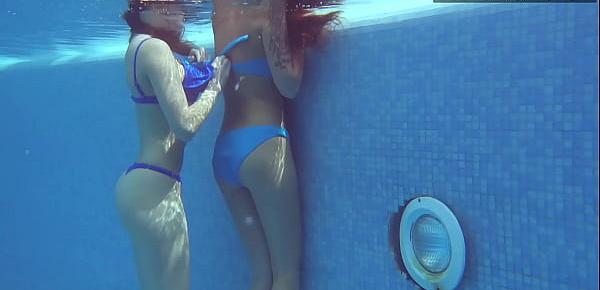  Two hot lesbian brunettes in the swimming pool